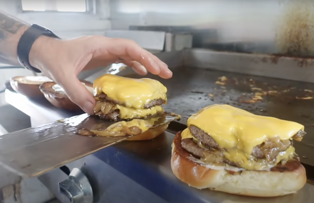 chef Jeff Allen cooking smash burgers from Miller's All Day on the Food Boat youtube channel 